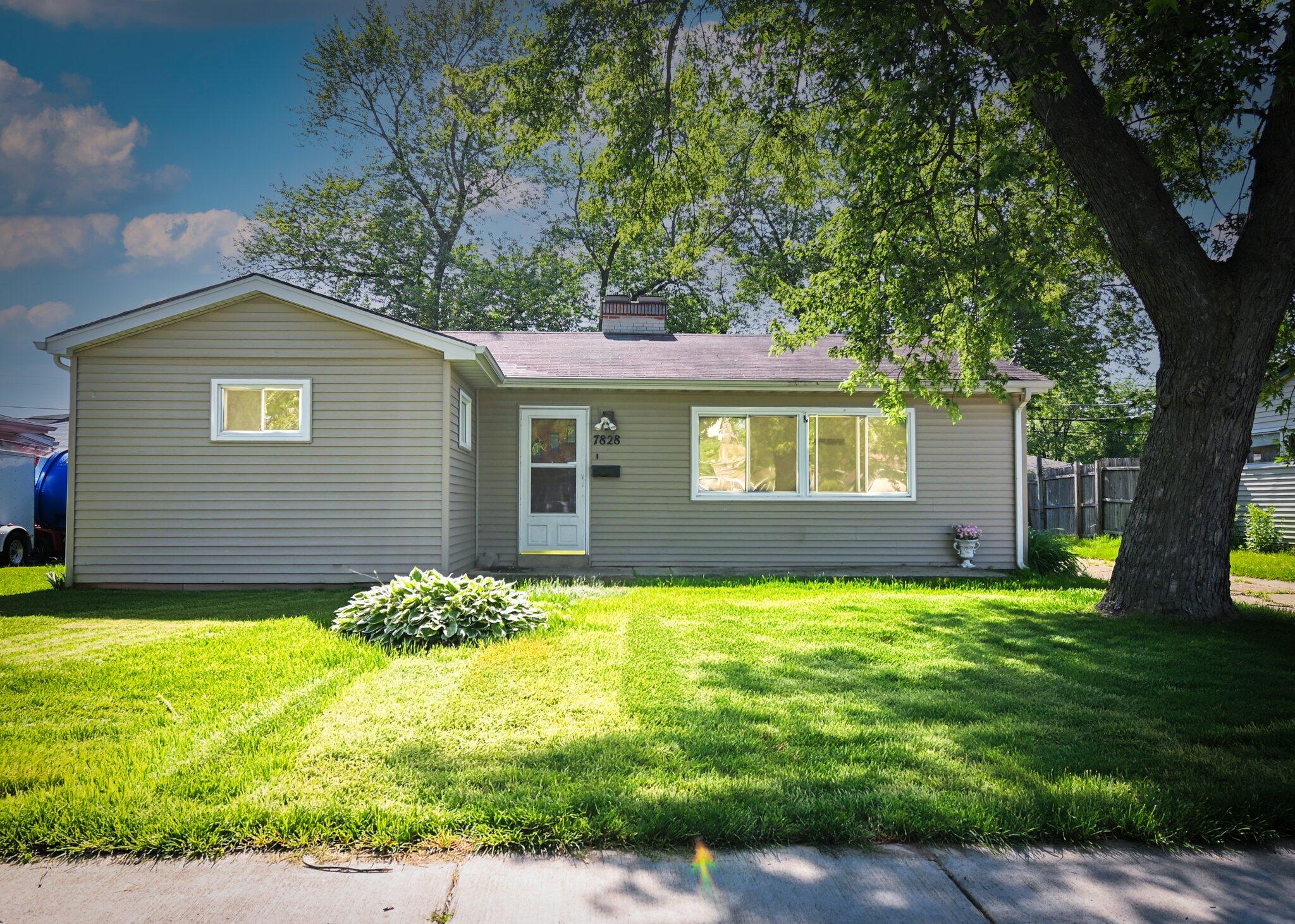 7828 Chestnut Avenue Hammond, IN 46324 - Photo 1 of 23 a view of a house with a yard