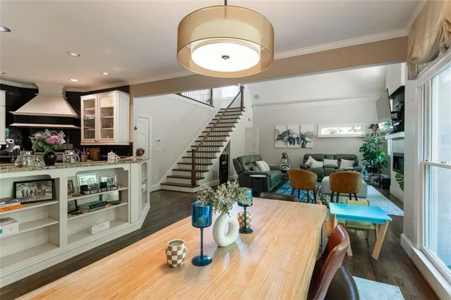 a dining room with furniture and wooden floor