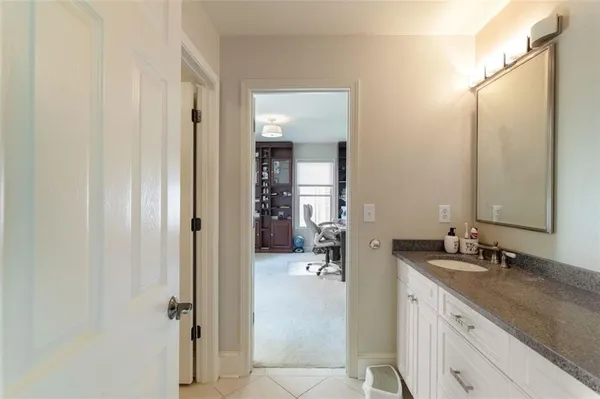 a bathroom with a sink and mirror