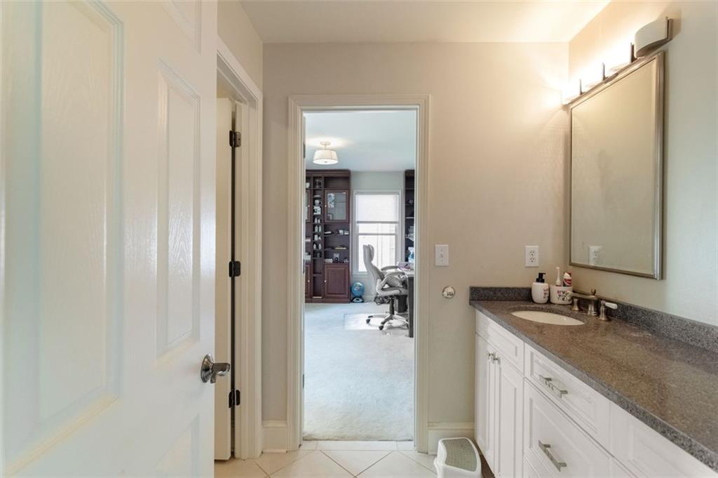 3850 Glenhurst Drive Smyrna, GA 30080 - Photo 23 of 43 a bathroom with a sink and mirror