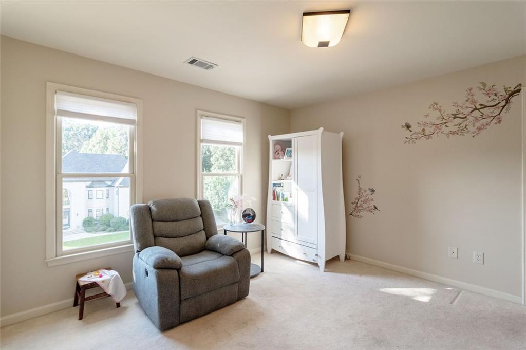 3850 Glenhurst Drive Smyrna, GA 30080 - Photo 24 of 43 a living room with furniture and a window