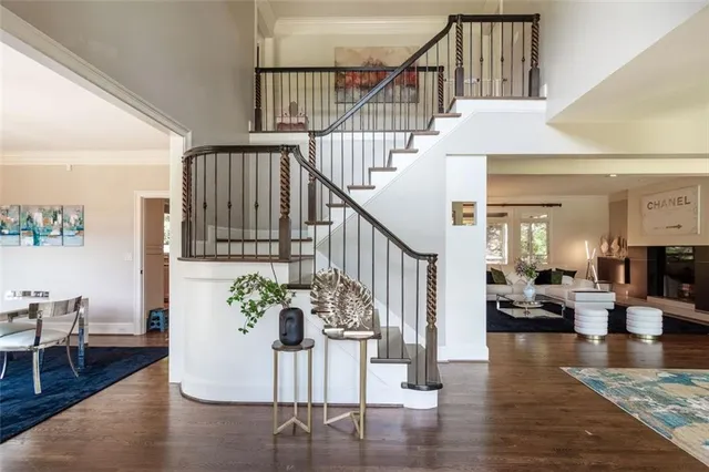 a view of entryway dining room and hall with wooden floor