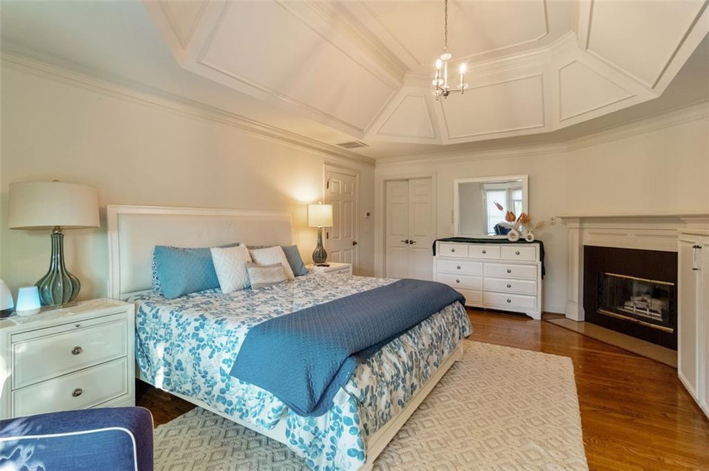 3850 Glenhurst Drive Smyrna, GA 30080 - Photo 31 of 43 a bedroom with a bed and a fireplace