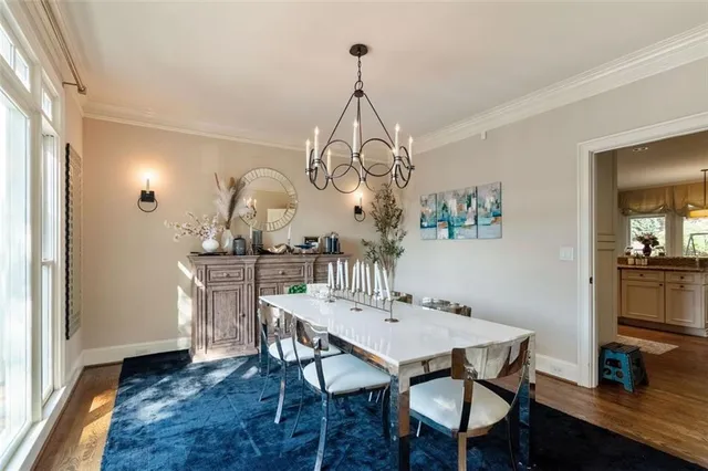 a view of a dining room with furniture and wooden floor
