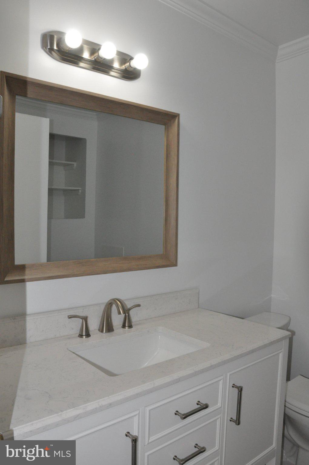 28 Henry Way Linden, VA 22642 - Photo 20 of 39 a bathroom with a sink and a mirror