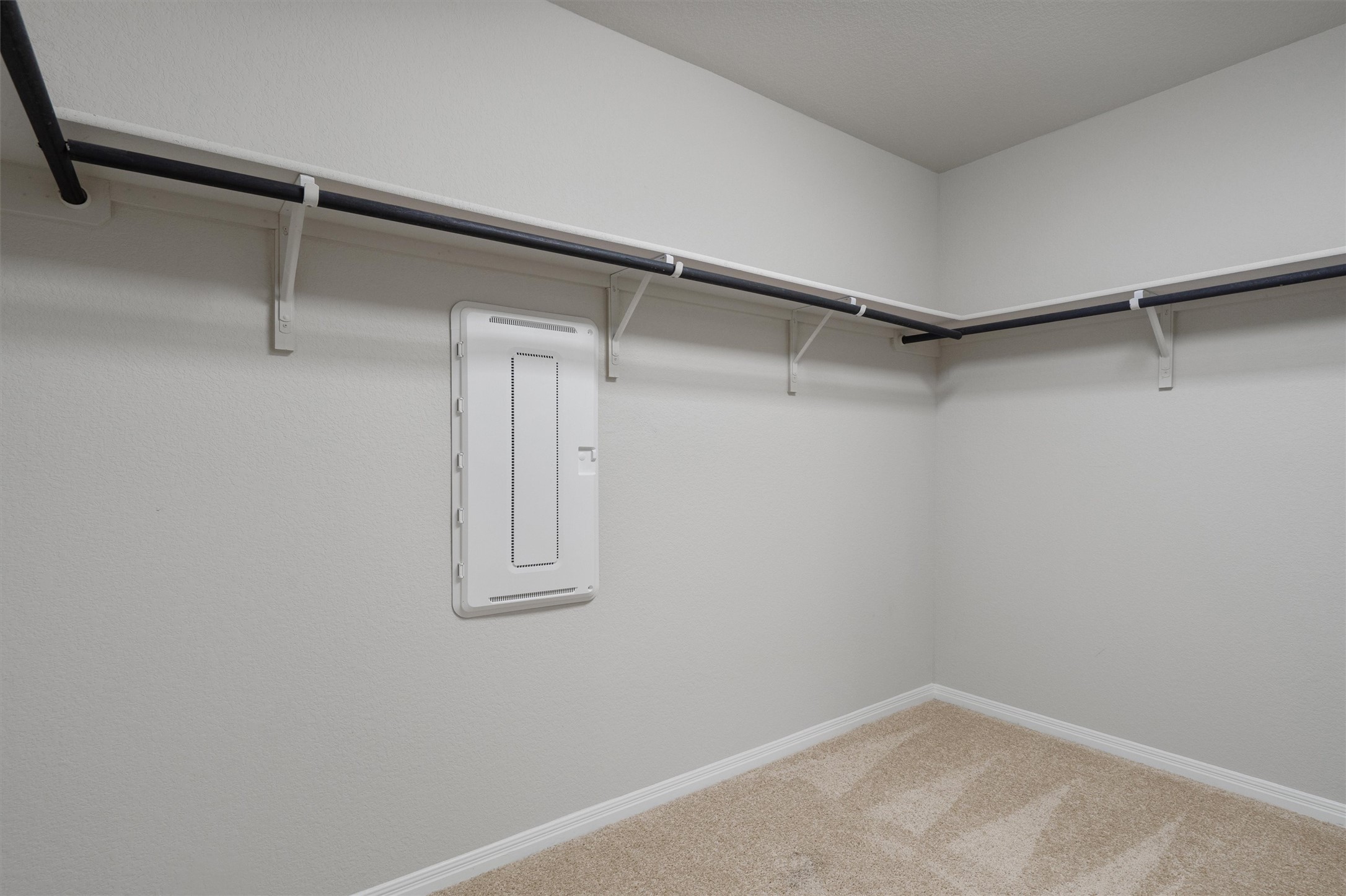 19525 Abigail Fillmore Road Manor, TX 78653 - Photo 18 of 38 Functional closet space offers ample storage with convenient shelving and hanging rods.