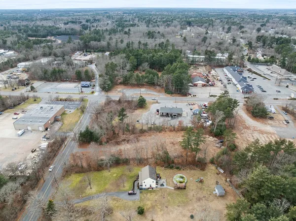 an aerial view of a house with a yard