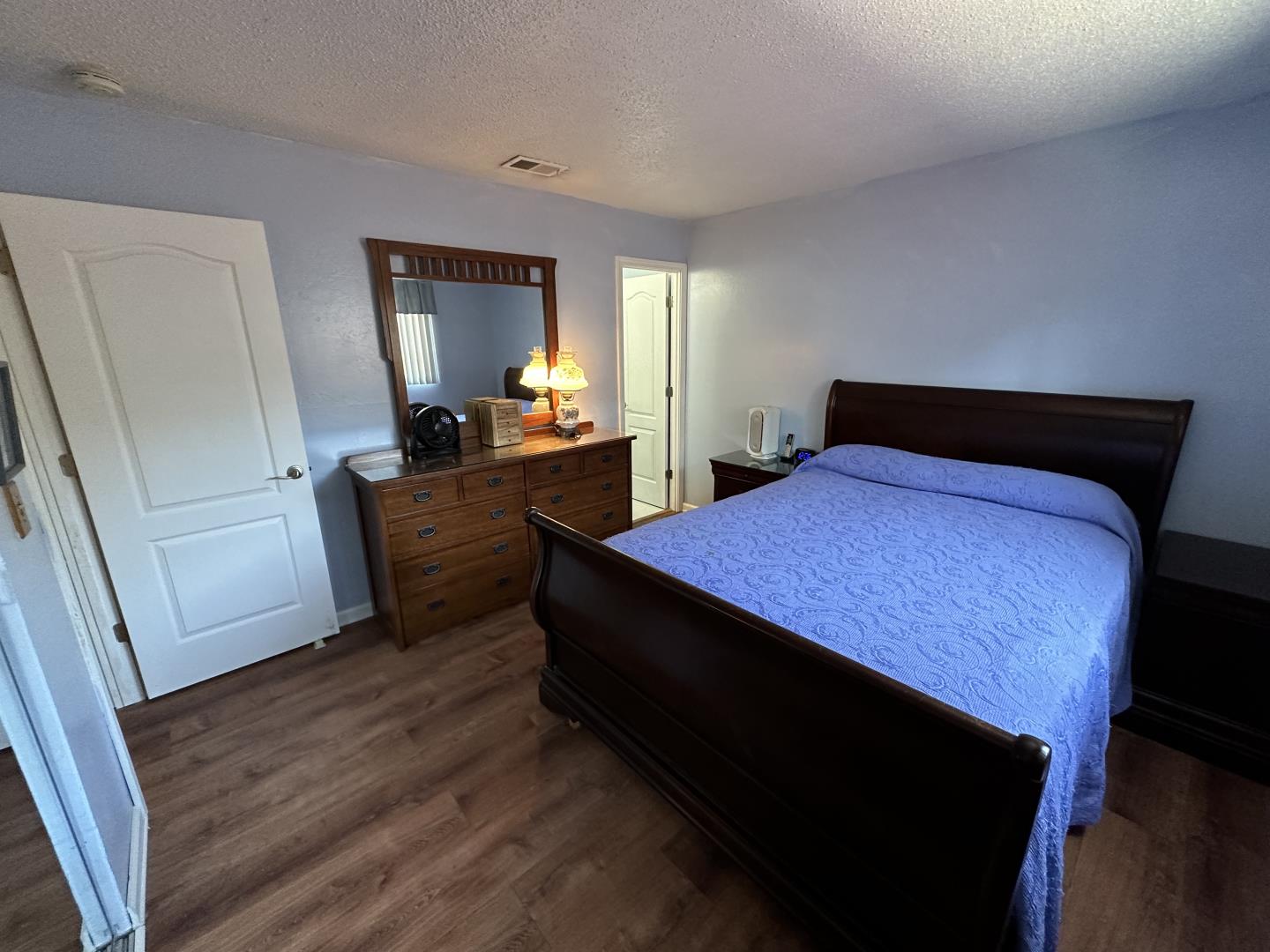 1632 Dixie Drive San Jose, CA 95122 - Photo 19 of 28 a bedroom with a bed and wooden floor