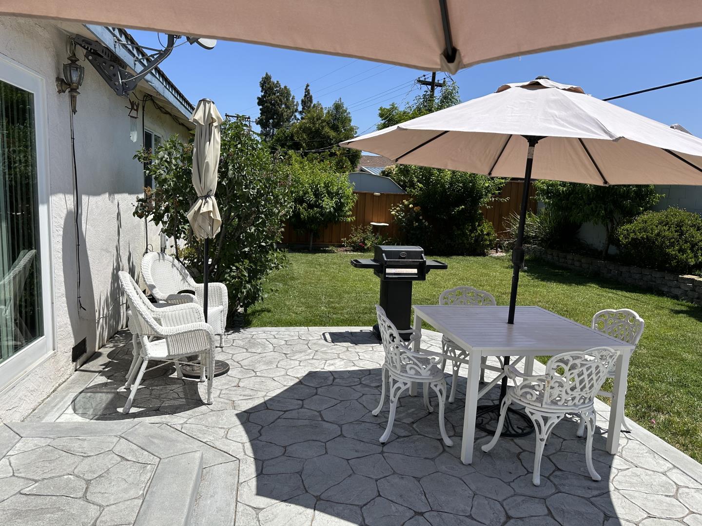 1632 Dixie Drive San Jose, CA 95122 - Photo 25 of 28 a view of a patio with a table and chairs under an umbrella