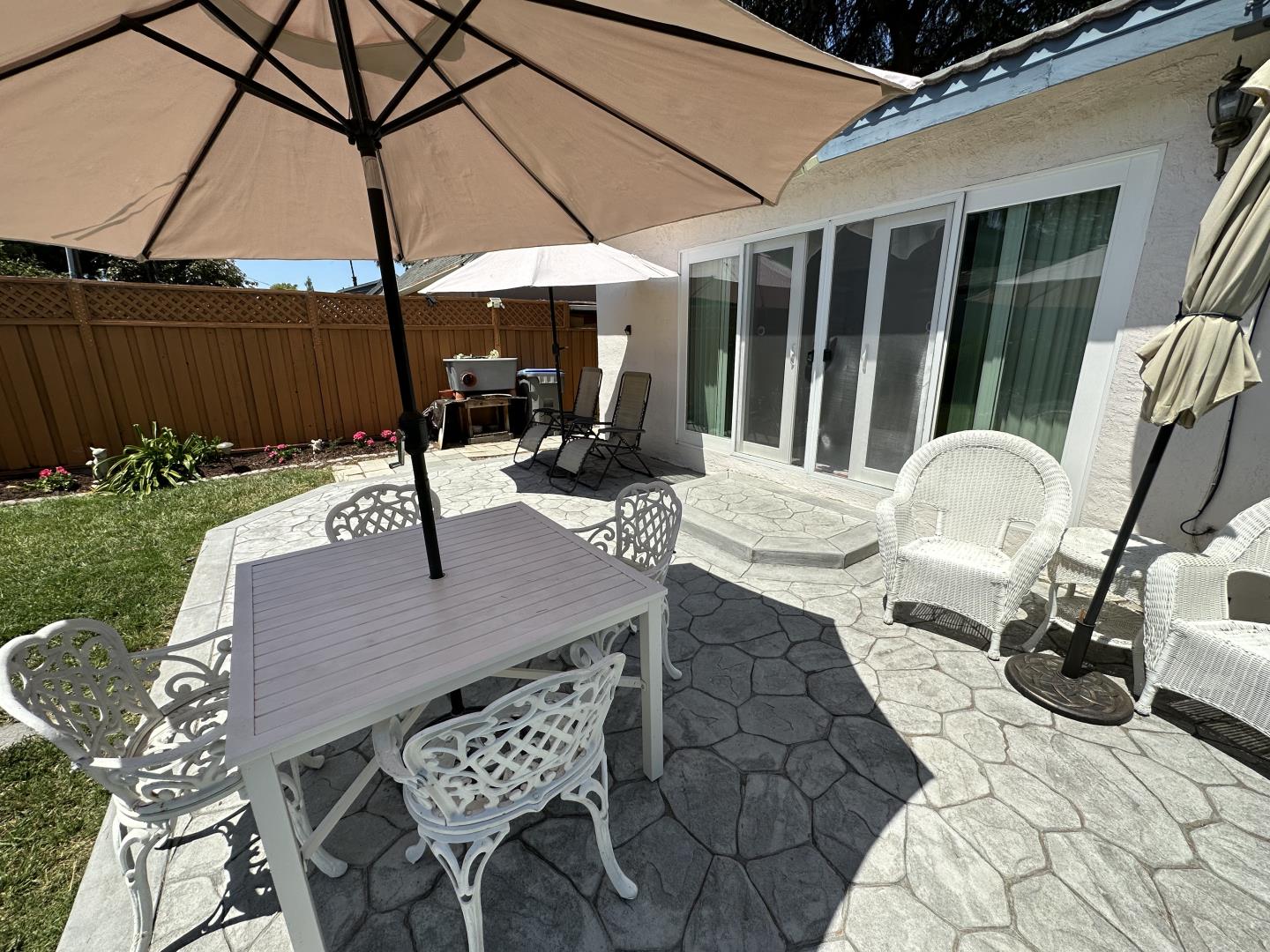 1632 Dixie Drive San Jose, CA 95122 - Photo 26 of 28 a view of a patio with table and chairs under an umbrella