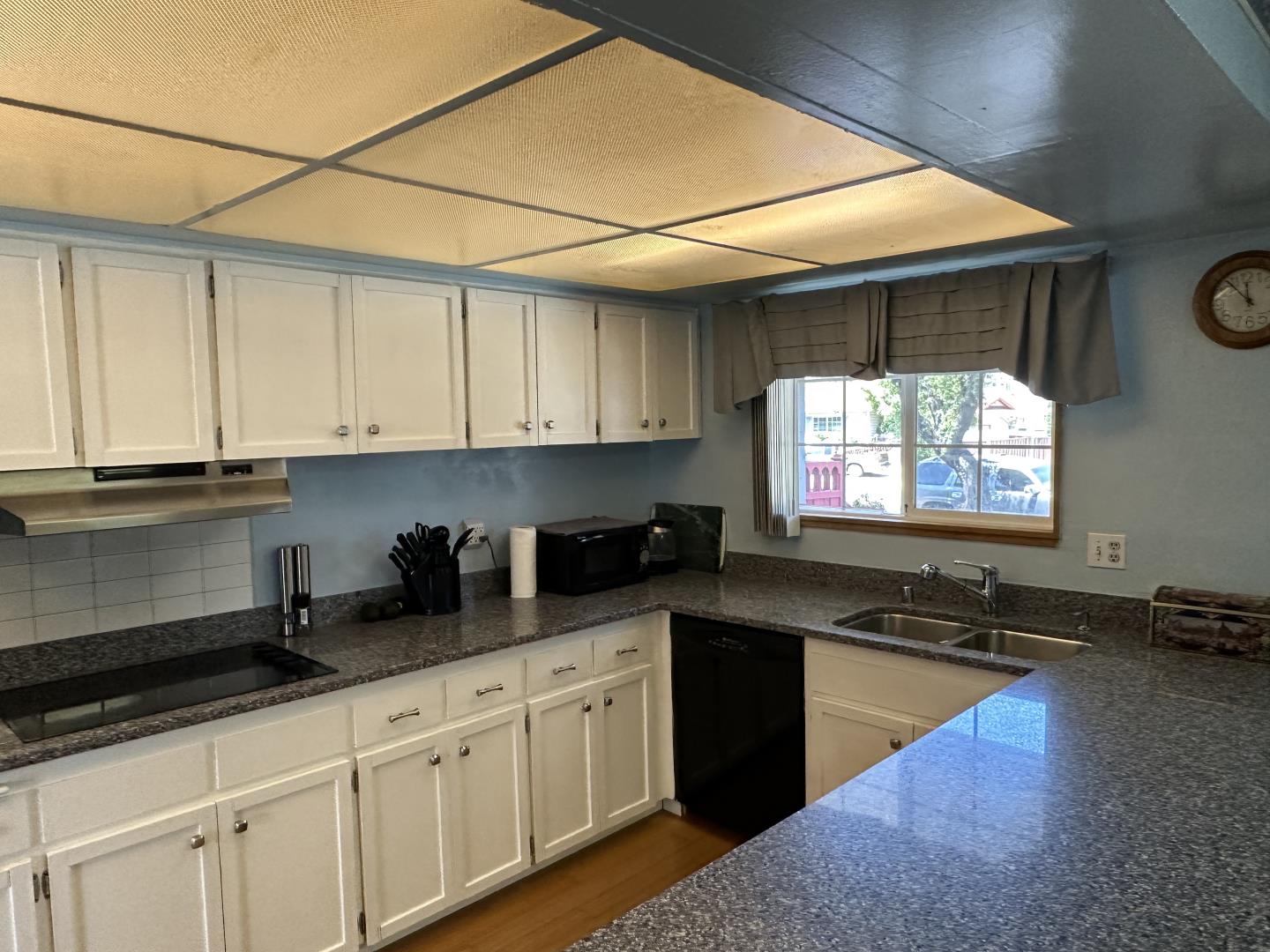 1632 Dixie Drive San Jose, CA 95122 - Photo 6 of 28 a kitchen with granite countertop a sink window and cabinets