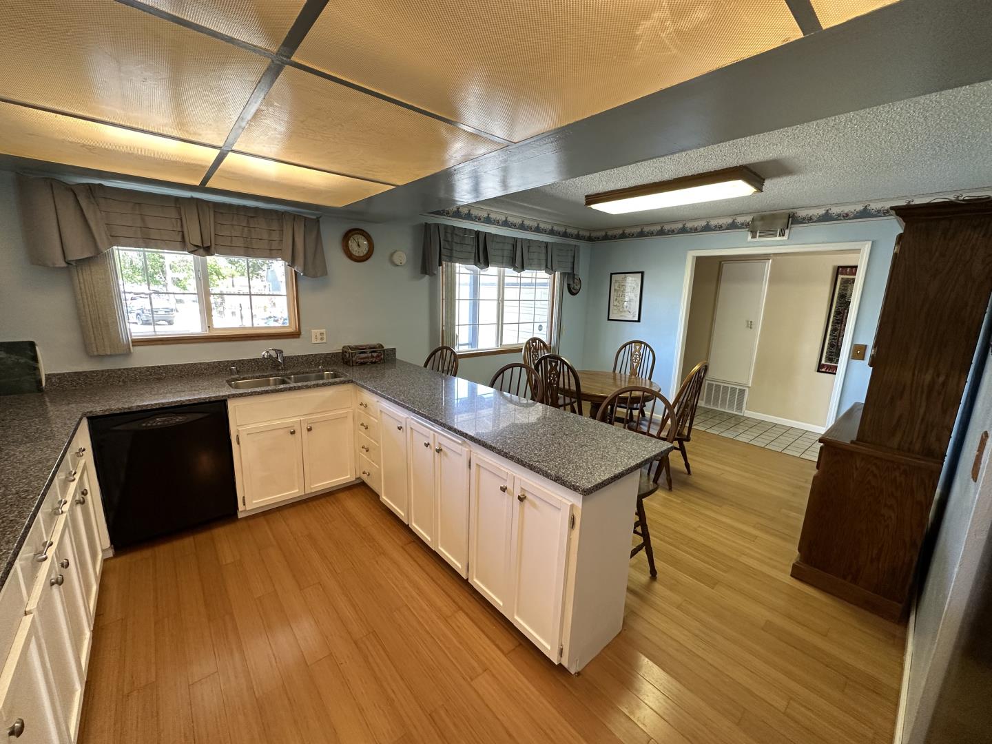 1632 Dixie Drive San Jose, CA 95122 - Photo 7 of 28 a large kitchen with a sink appliances wooden floor and a window