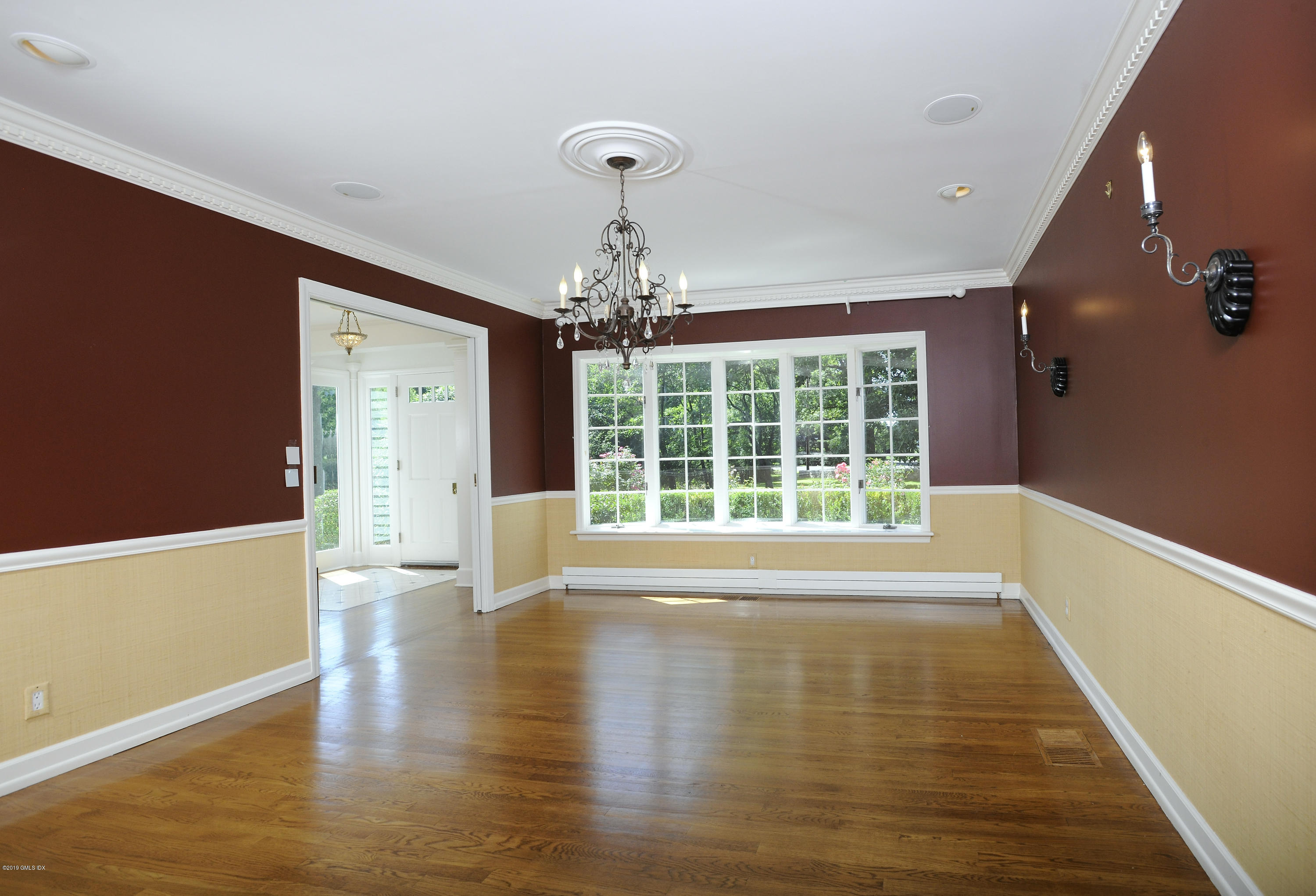 177 Indian Head Road Riverside, CT 06878 - Photo 17 of 24 a view of empty room with wooden floor and fan