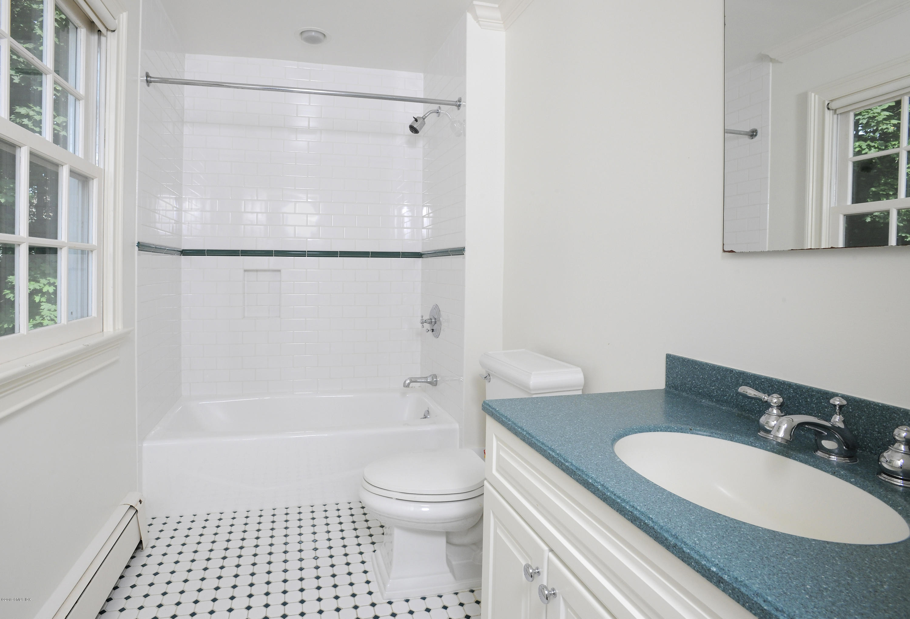 177 Indian Head Road Riverside, CT 06878 - Photo 23 of 24 a bathroom with a granite countertop sink toilet a mirror and shower
