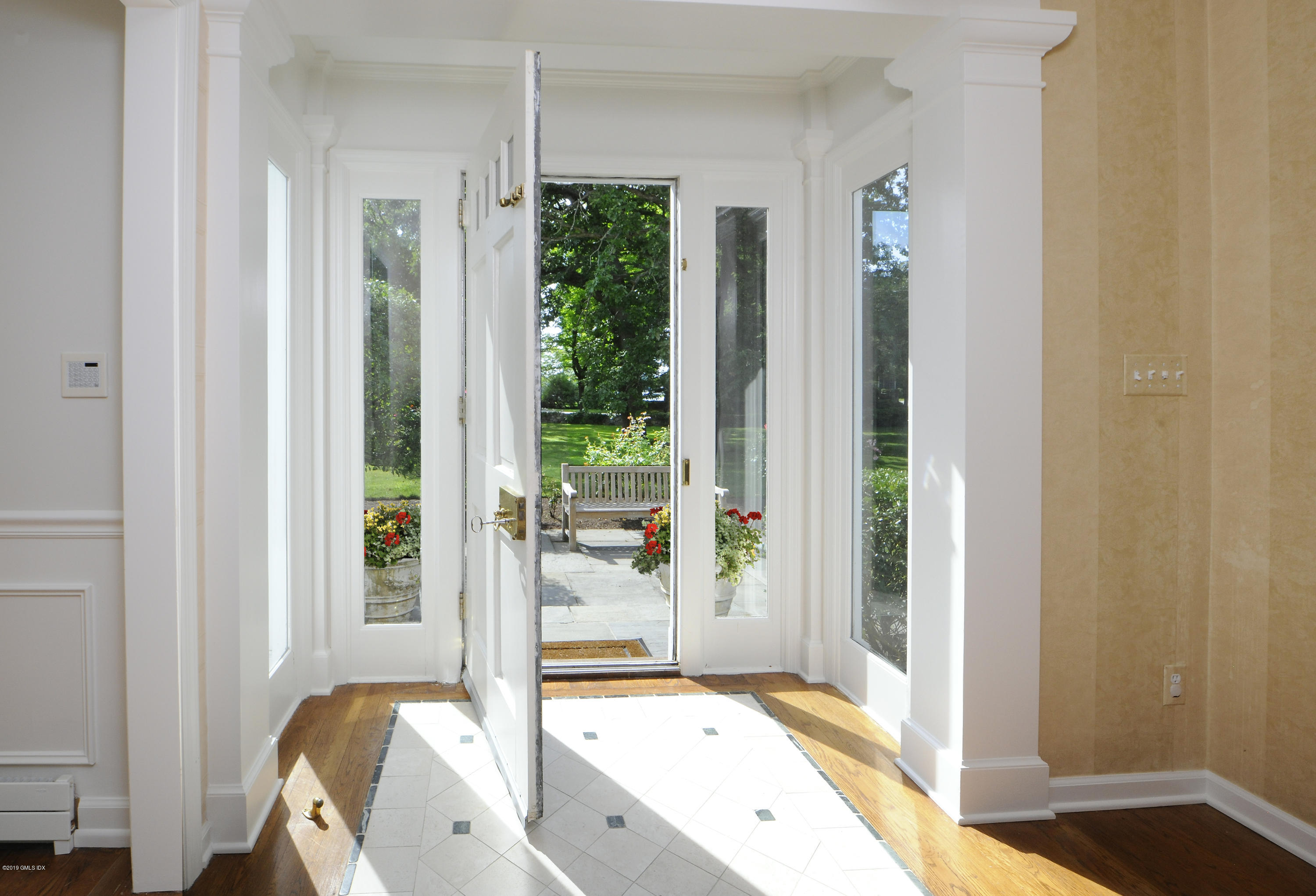 177 Indian Head Road Riverside, CT 06878 - Photo 5 of 24 a view of a bedroom with a bed and wooden floor