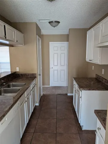 a kitchen with a stove and a sink