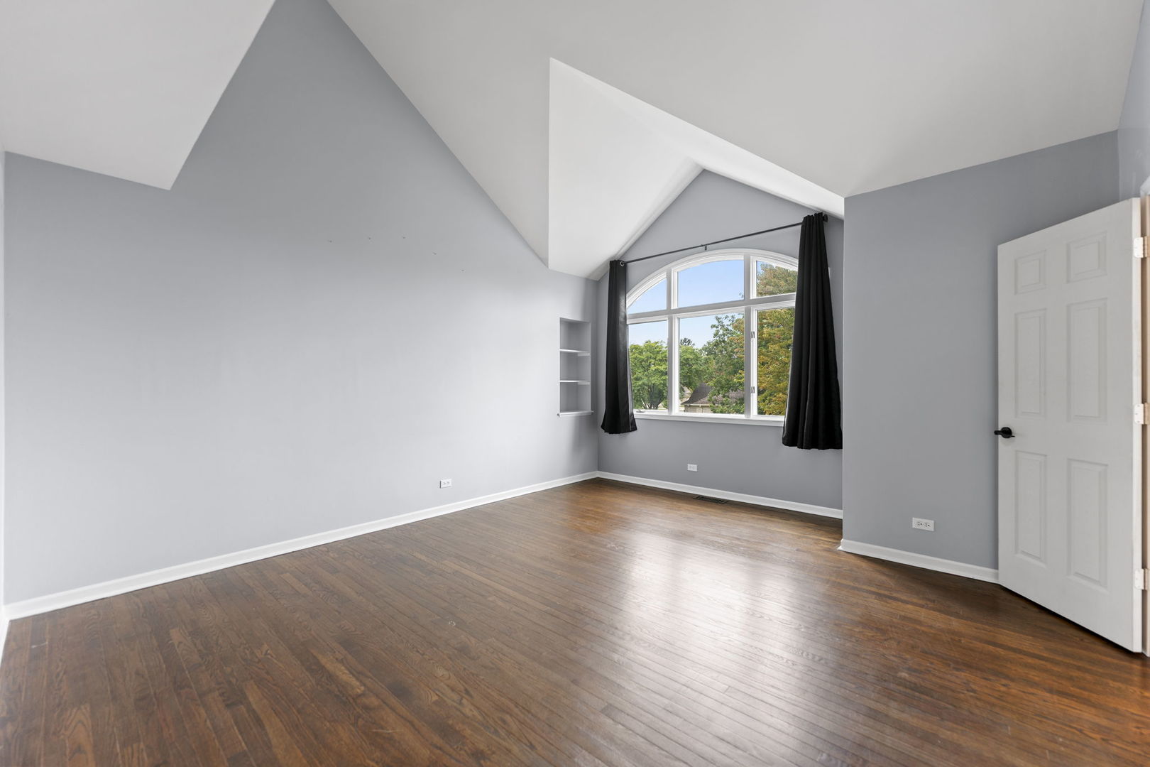 5509 Aspen Avenue Downers Grove, IL 60515 - Photo 16 of 38 a view of an empty room with wooden floor and windows