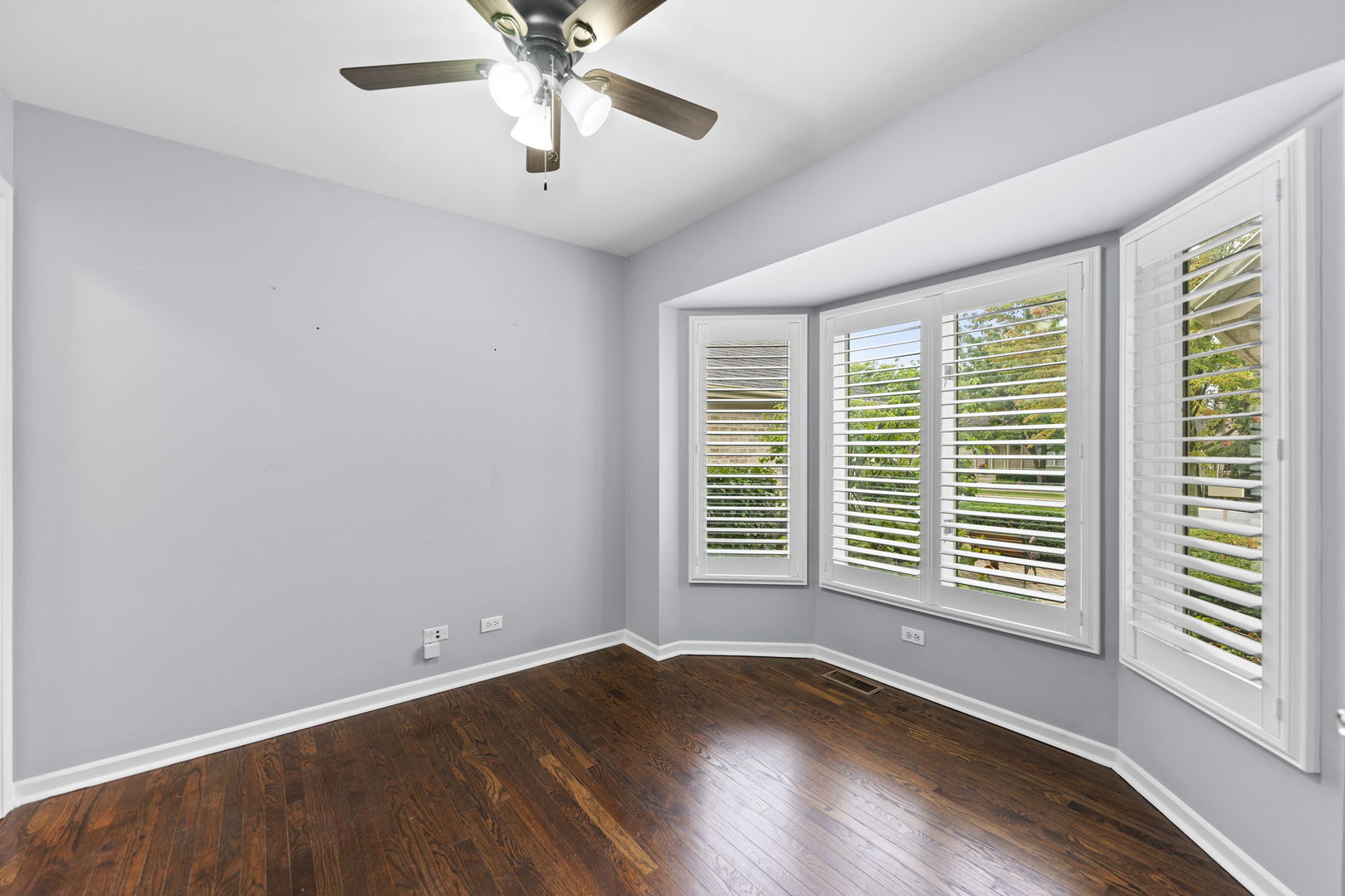 5509 Aspen Avenue Downers Grove, IL 60515 - Photo 22 of 38 a view of an empty room with a window and wooden floor