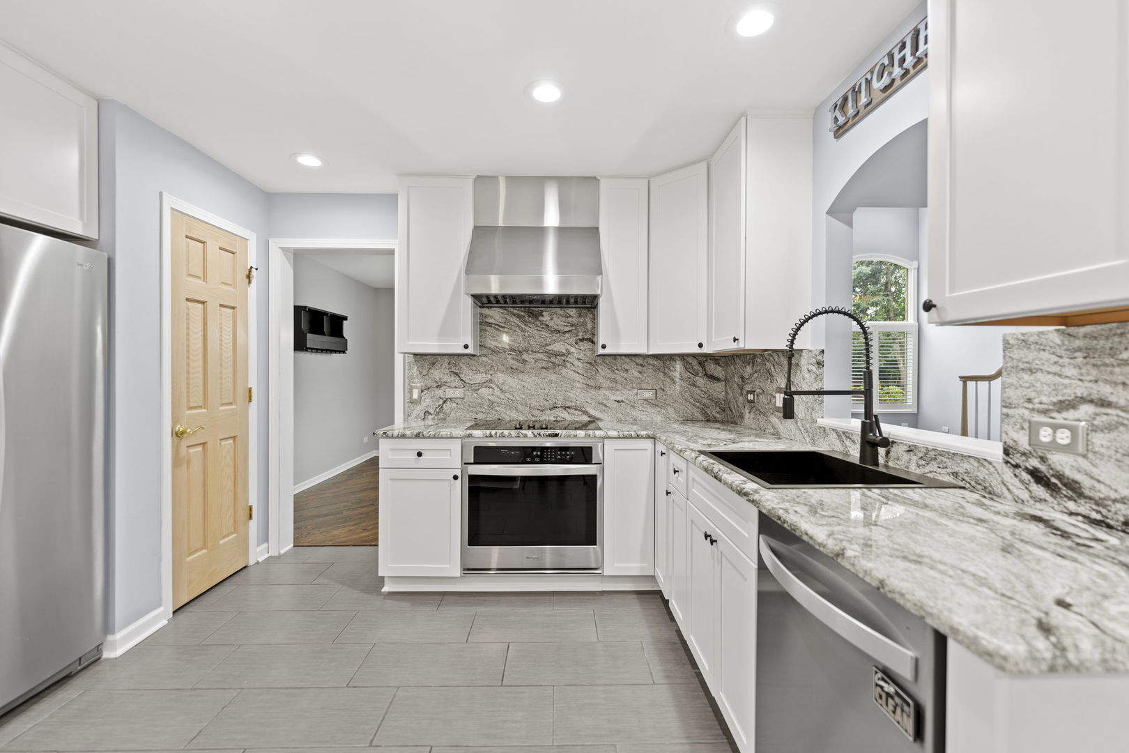 5509 Aspen Avenue Downers Grove, IL 60515 - Photo 4 of 38 a kitchen with stainless steel appliances granite countertop a stove sink and cabinets