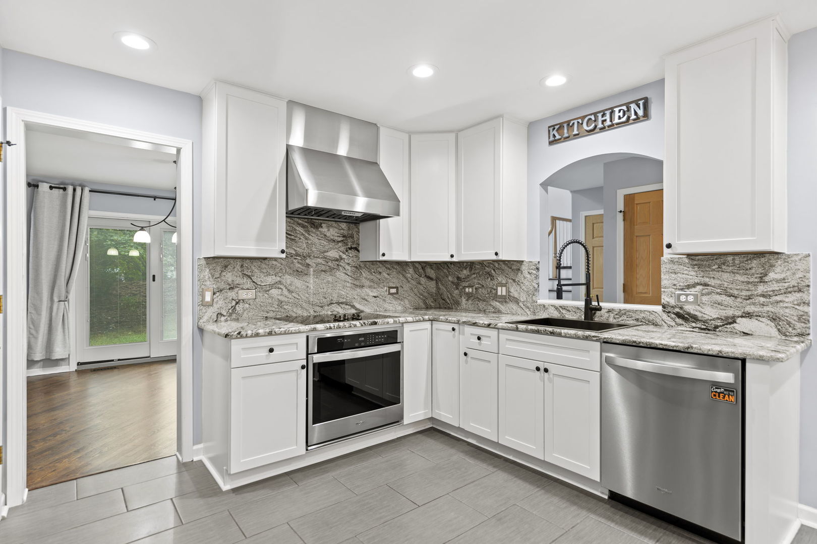 5509 Aspen Avenue Downers Grove, IL 60515 - Photo 5 of 38 a kitchen with granite countertop white cabinets white stainless steel appliances with a sink and dishwasher