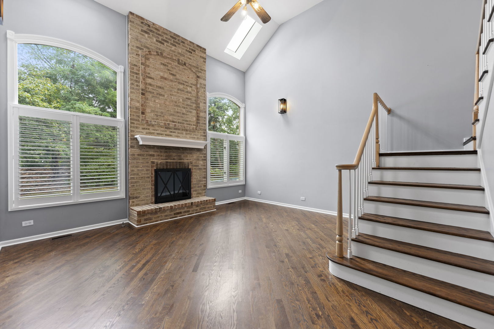 5509 Aspen Avenue Downers Grove, IL 60515 - Photo 9 of 38 a view of a livingroom with wooden floor and a fireplace