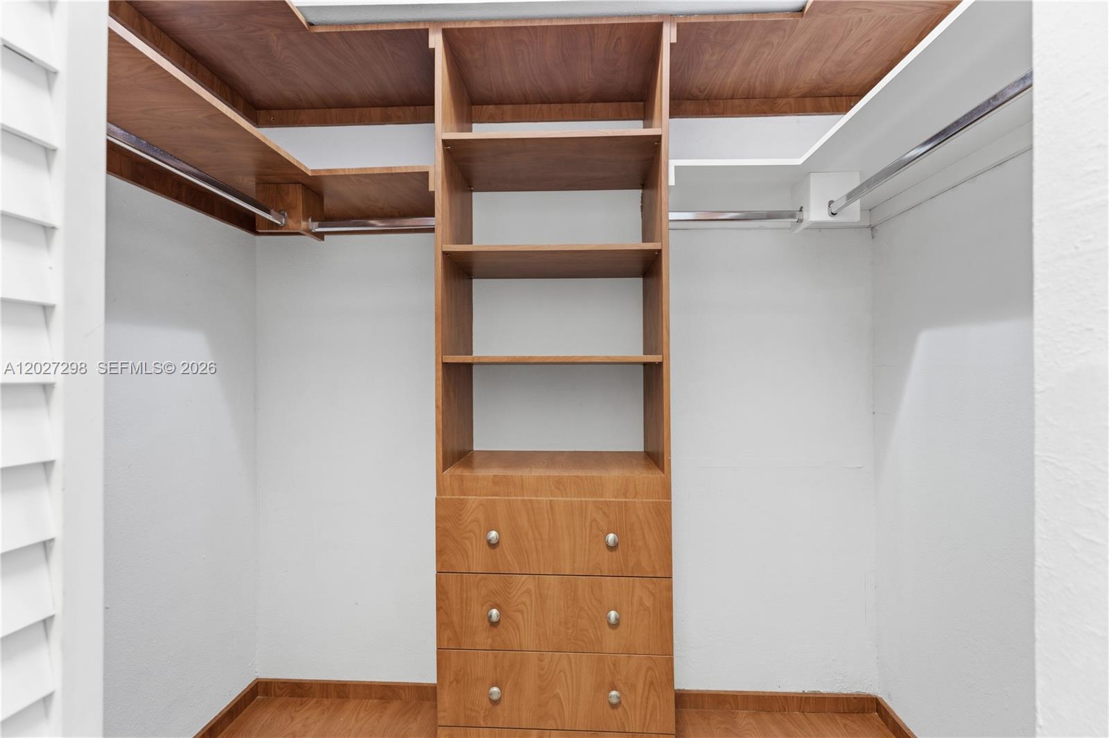 1665 Bay Road, Unit 322 Miami Beach, FL 33139 - Photo 14 of 24 a view of walk in closet with empty racks