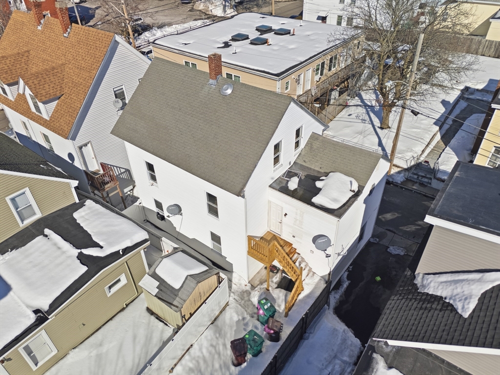 5 Floyd Street Lowell, MA 01852 - Photo 1 of 35 an aerial view of a house with backyard
