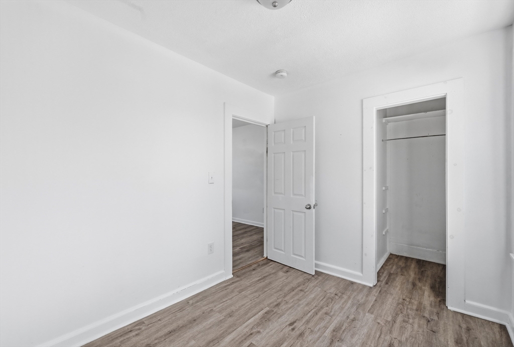 5 Floyd Street Lowell, MA 01852 - Photo 19 of 35 a view of an empty room and wooden floor