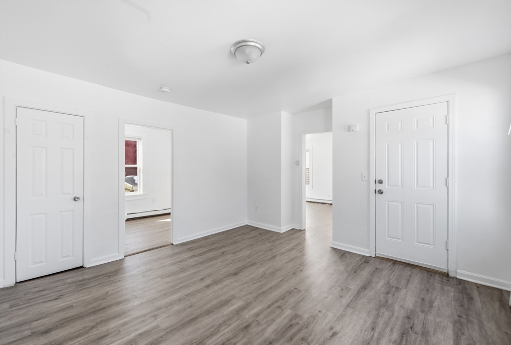 5 Floyd Street Lowell, MA 01852 - Photo 22 of 35 a view of empty room with wooden floor