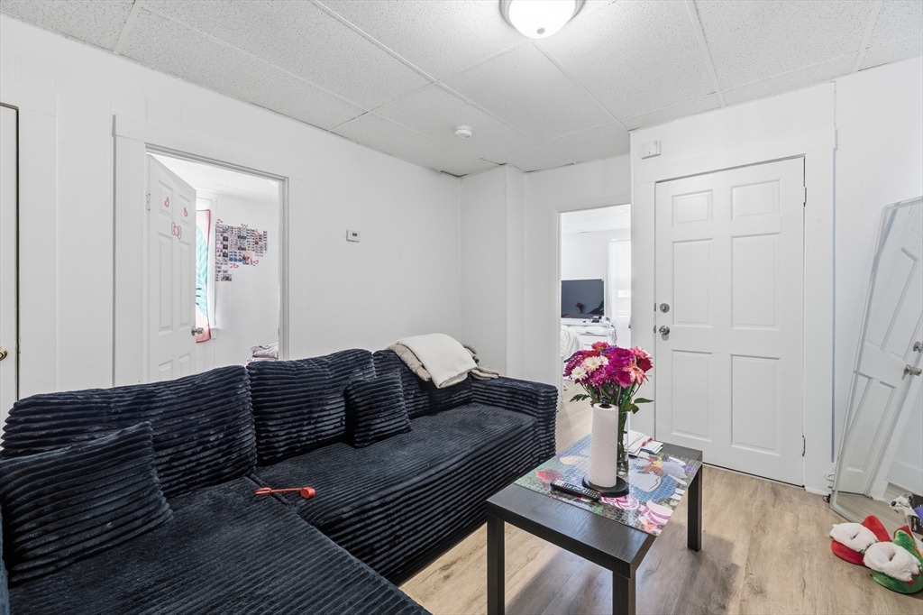 5 Floyd Street Lowell, MA 01852 - Photo 28 of 35 a living room with furniture and flowers