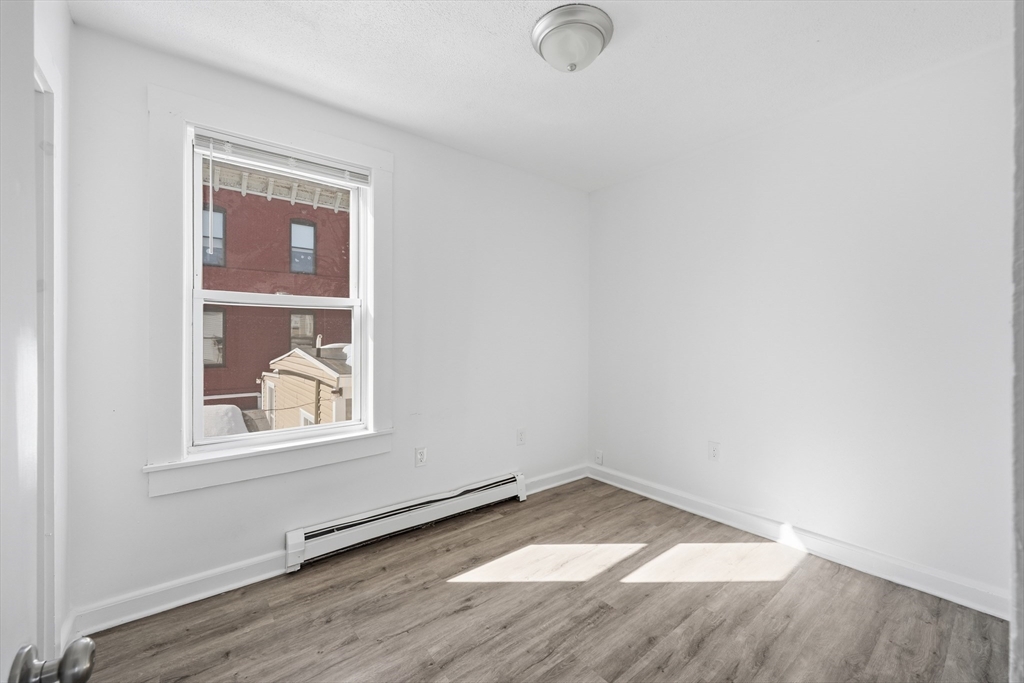 5 Floyd Street Lowell, MA 01852 - Photo 8 of 35 an empty room with a window