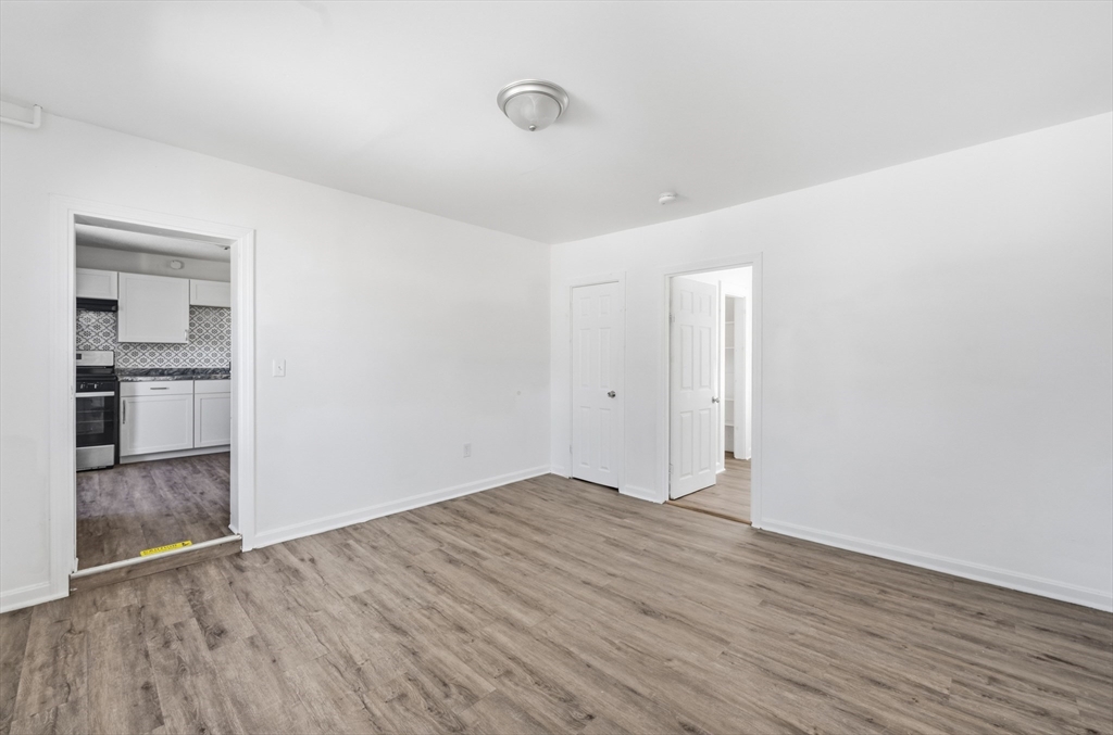 5 Floyd Street Lowell, MA 01852 - Photo 9 of 35 a view of empty room with wooden floor