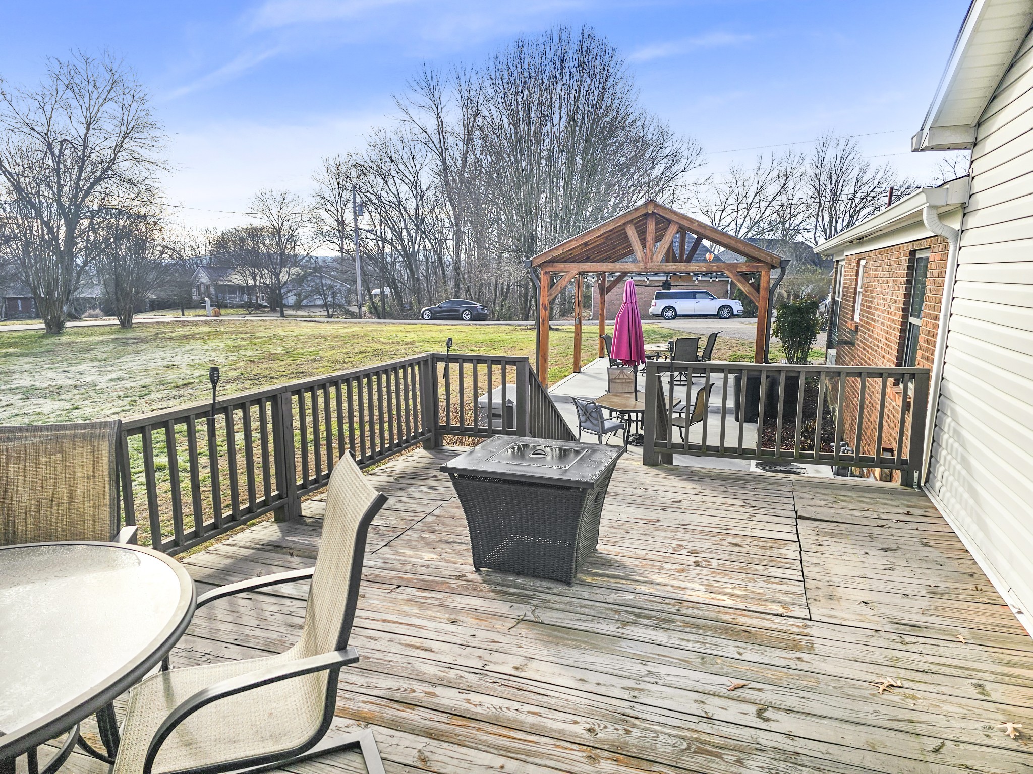 55 Morris Lane Carthage, TN 37030 - Photo 29 of 47 a view of a roof deck with table and chairs wooden floor and fence