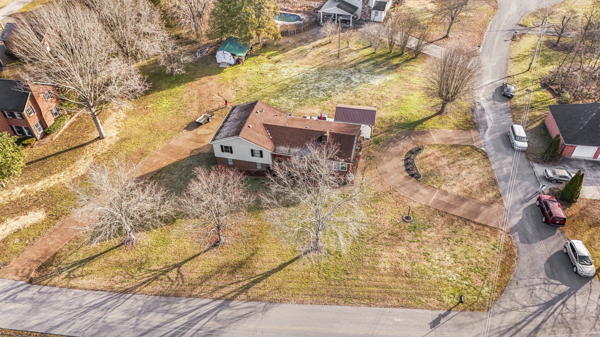 55 Morris Lane Carthage, TN 37030 - Photo 41 of 47 a backyard of a house with large trees and outdoor seating