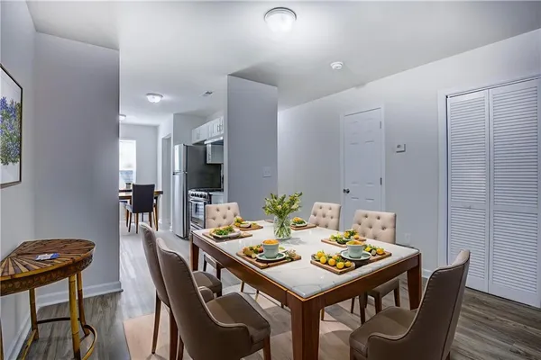 a view of a dining area with furniture and wooden floor
