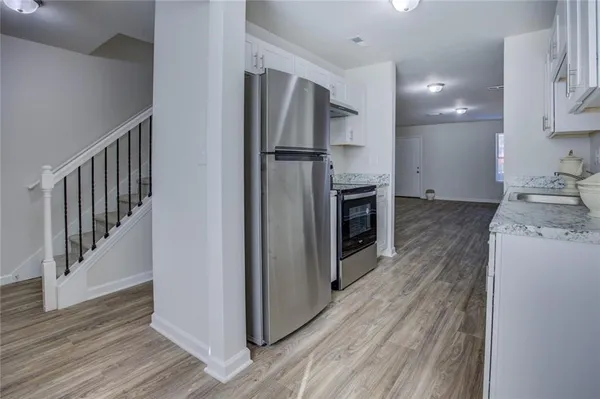 a view of a kitchen from the hallway