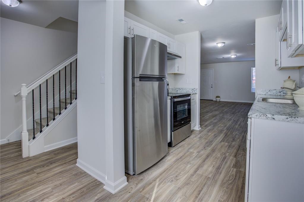 2340 Beaver Ruin Road, Unit UN15 Norcross, GA 30071 - Photo 16 of 30 a view of a kitchen from the hallway