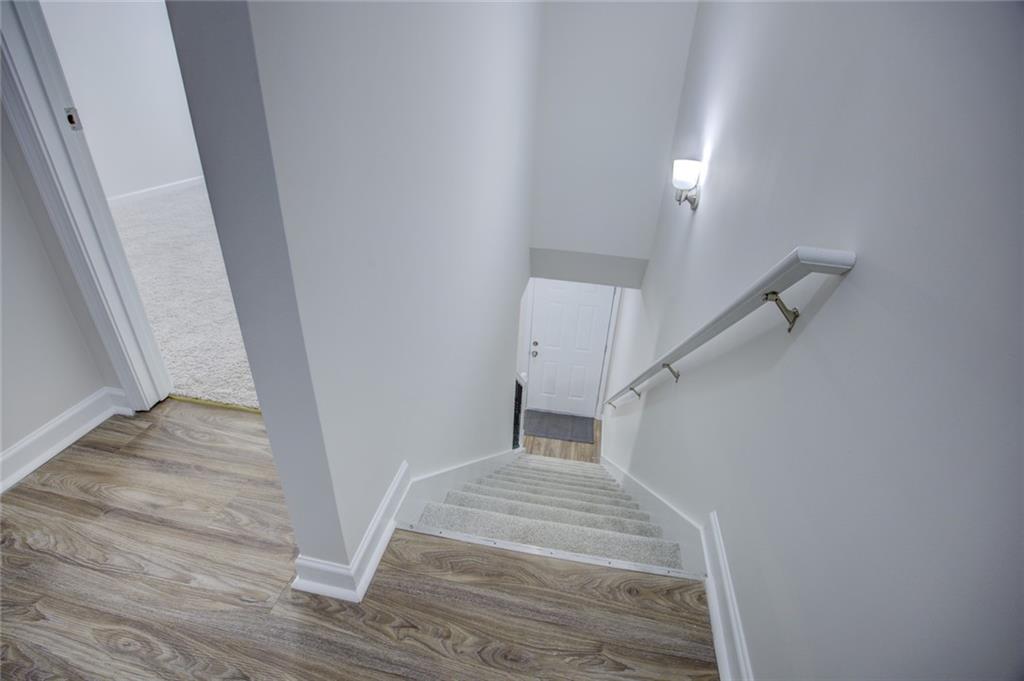 2340 Beaver Ruin Road, Unit UN15 Norcross, GA 30071 - Photo 18 of 30 a view of entryway and hall with wooden floor