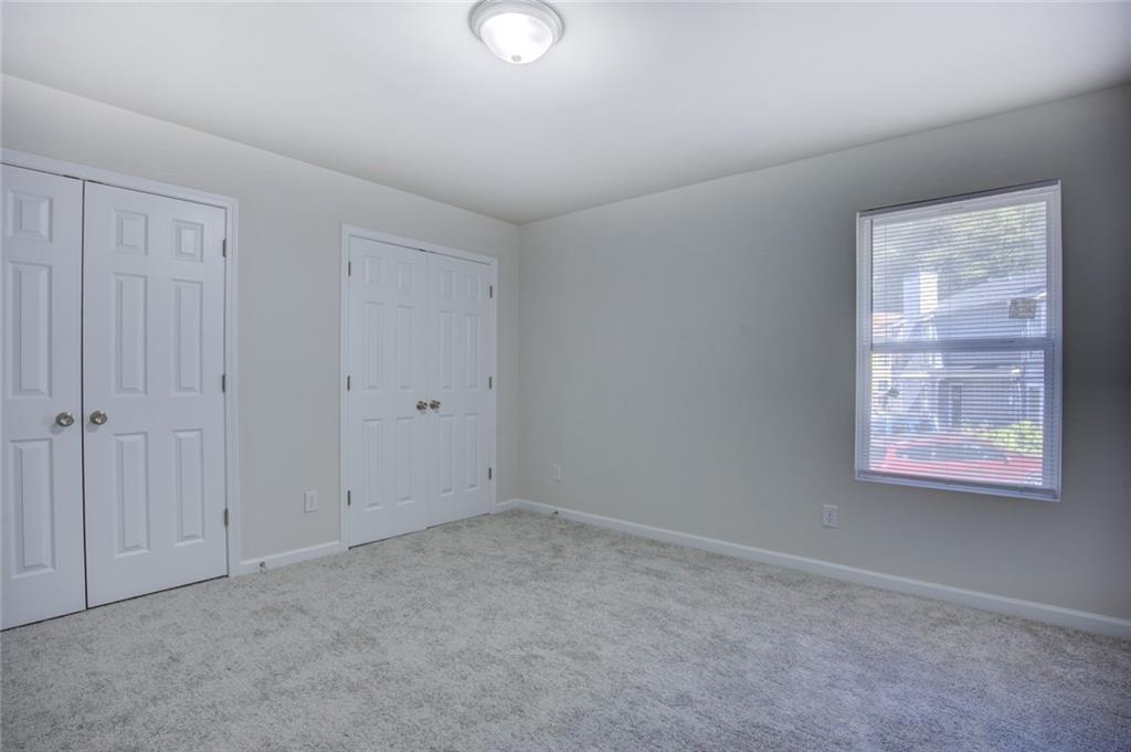 2340 Beaver Ruin Road, Unit UN15 Norcross, GA 30071 - Photo 19 of 30 a view of an empty room with a window