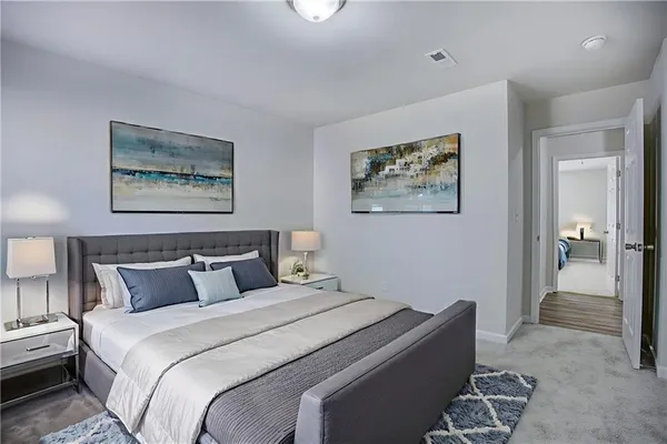 a bedroom with bed and wall painting