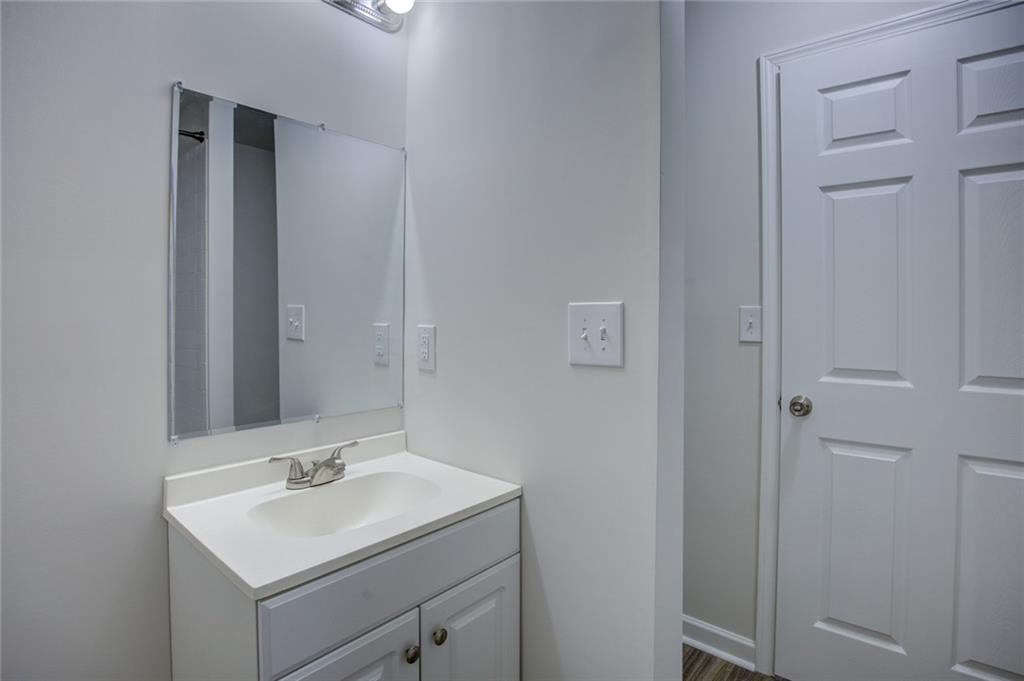 2340 Beaver Ruin Road, Unit UN15 Norcross, GA 30071 - Photo 23 of 30 a bathroom with a sink toilet and mirror