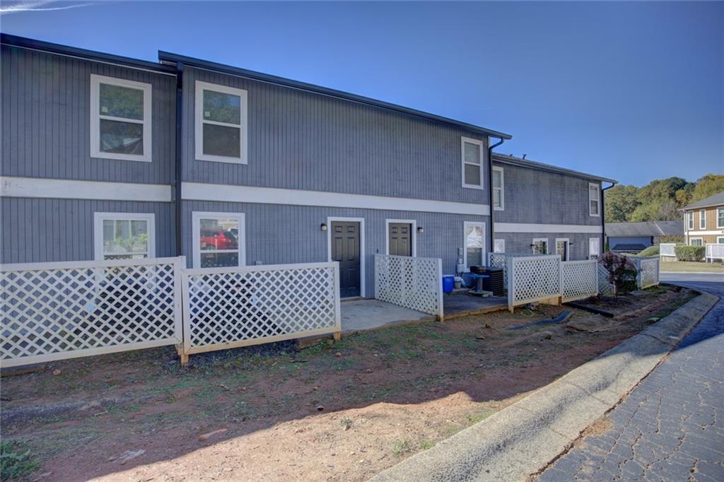2340 Beaver Ruin Road, Unit UN15 Norcross, GA 30071 - Photo 29 of 30 a view of a house with a patio
