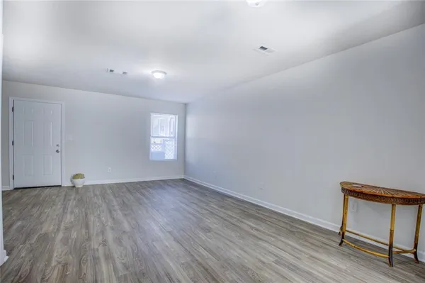 a view of an empty room and window