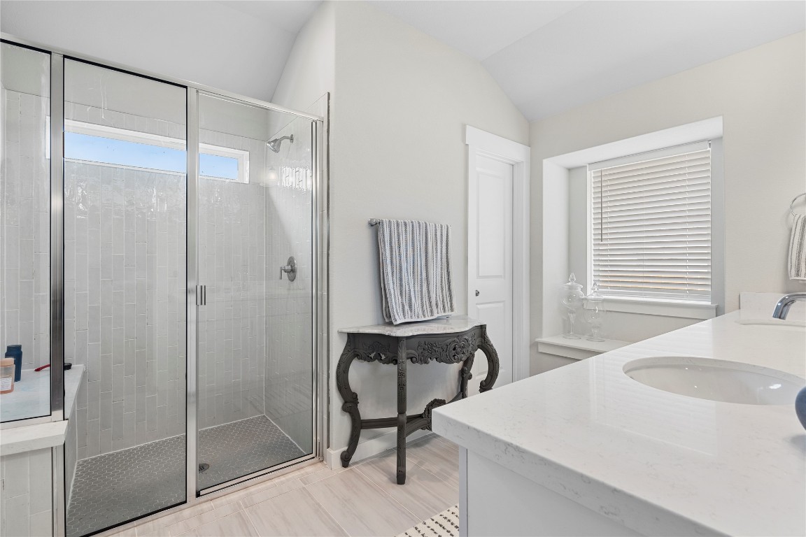 660 Pheasant Hill Lane Georgetown, TX 78628 - Photo 17 of 38 a bathroom with a sink and a shower