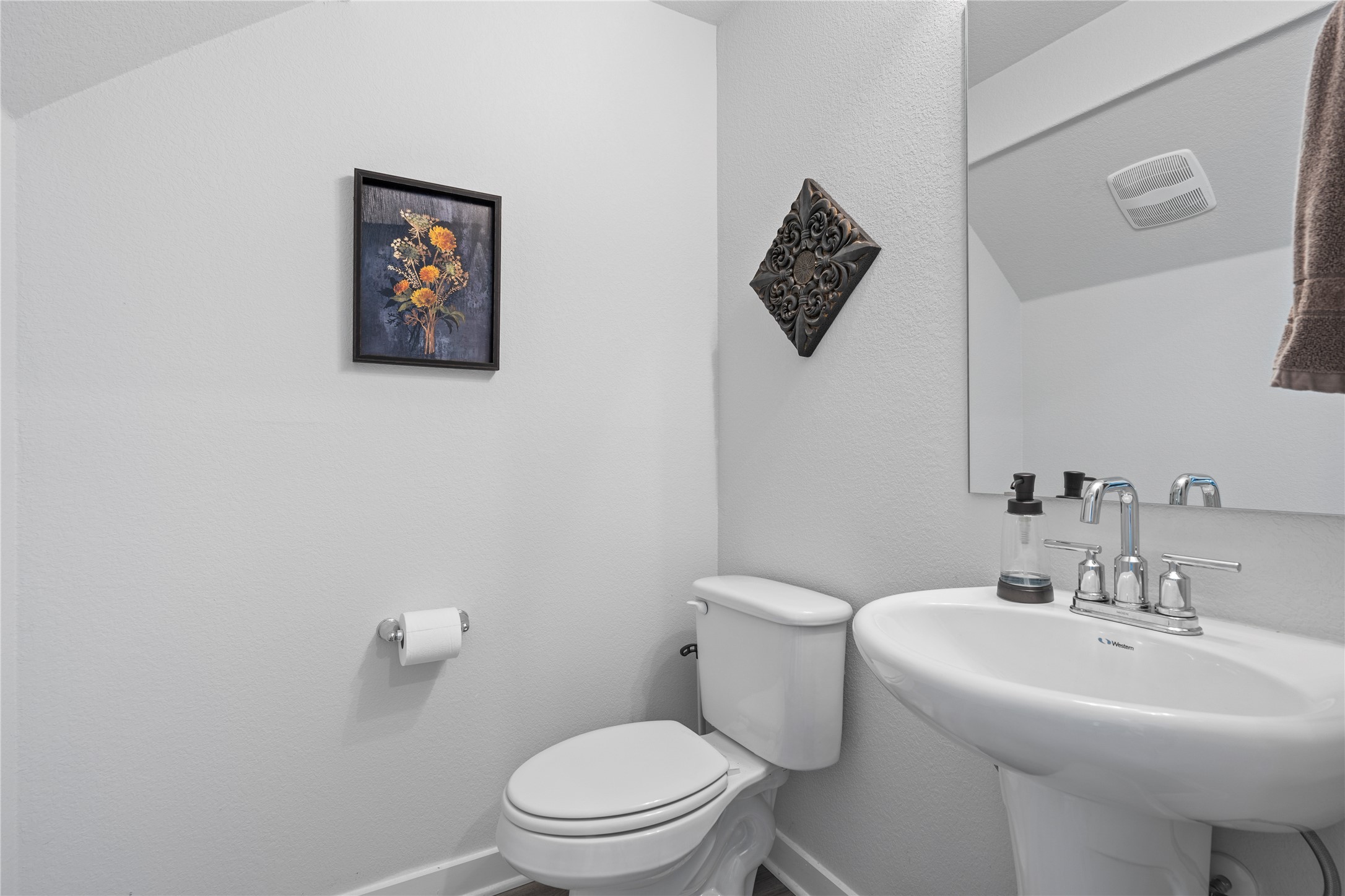 660 Pheasant Hill Lane Georgetown, TX 78628 - Photo 20 of 38 a white toilet sitting next to a white sink