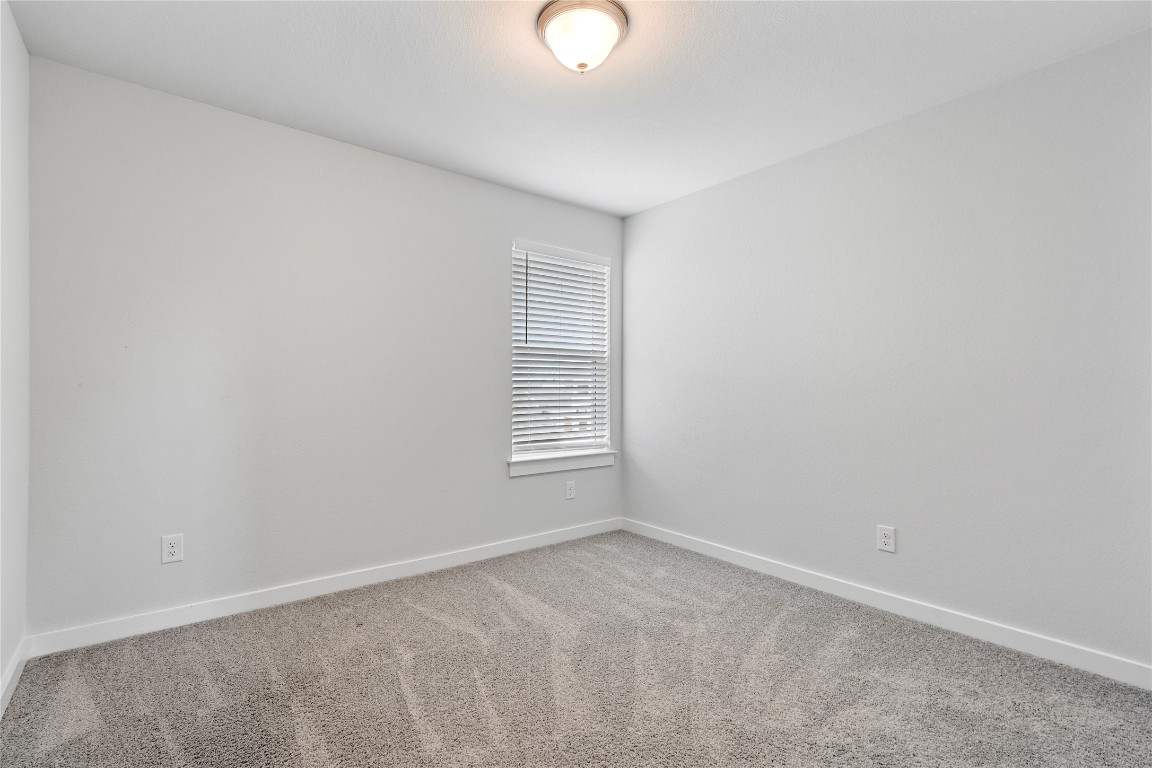 660 Pheasant Hill Lane Georgetown, TX 78628 - Photo 24 of 38 a view of an empty room with a window