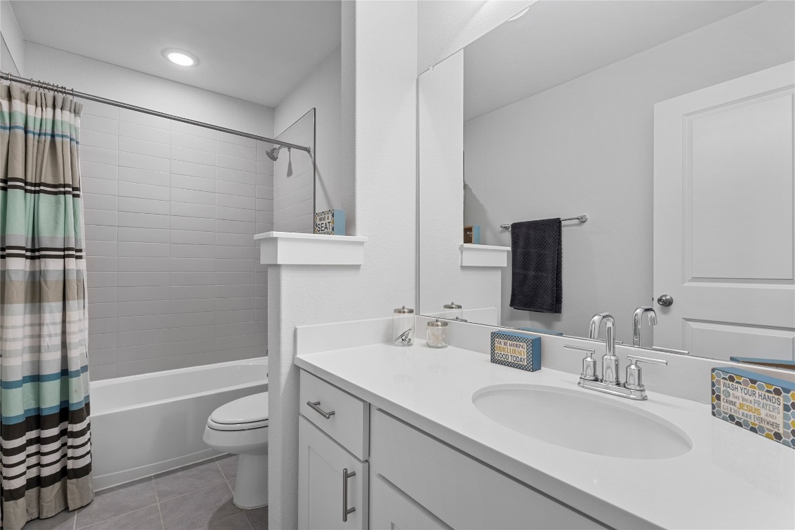 660 Pheasant Hill Lane Georgetown, TX 78628 - Photo 26 of 38 a bathroom with a sink a toilet and shower