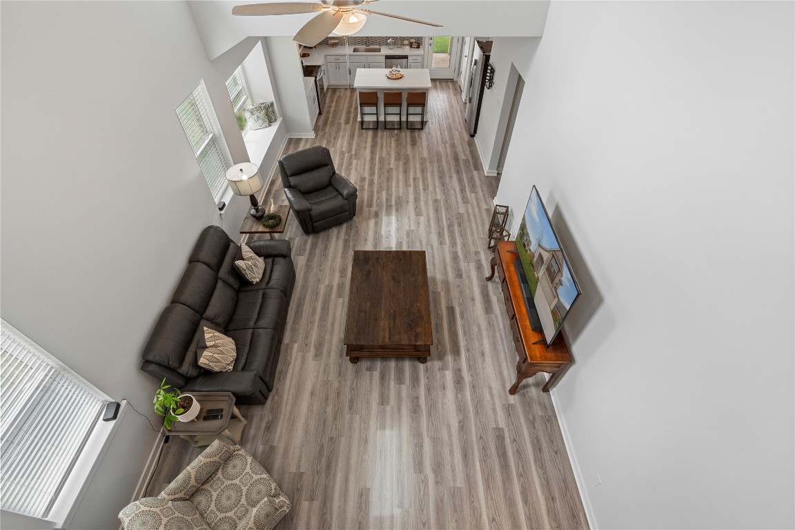 660 Pheasant Hill Lane Georgetown, TX 78628 - Photo 28 of 38 walk in closet with wooden floor washer and dryer