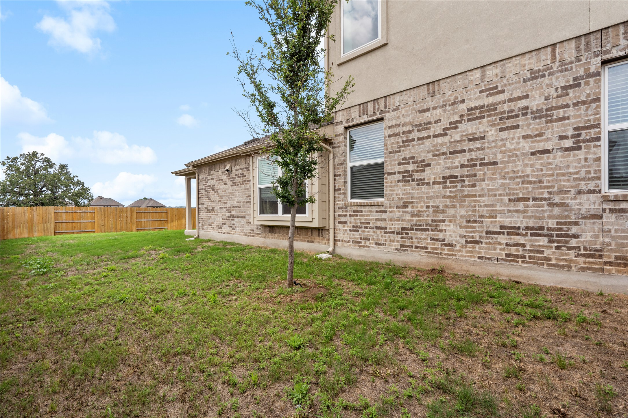 660 Pheasant Hill Lane Georgetown, TX 78628 - Photo 30 of 38 a backyard of a house with lots of green space