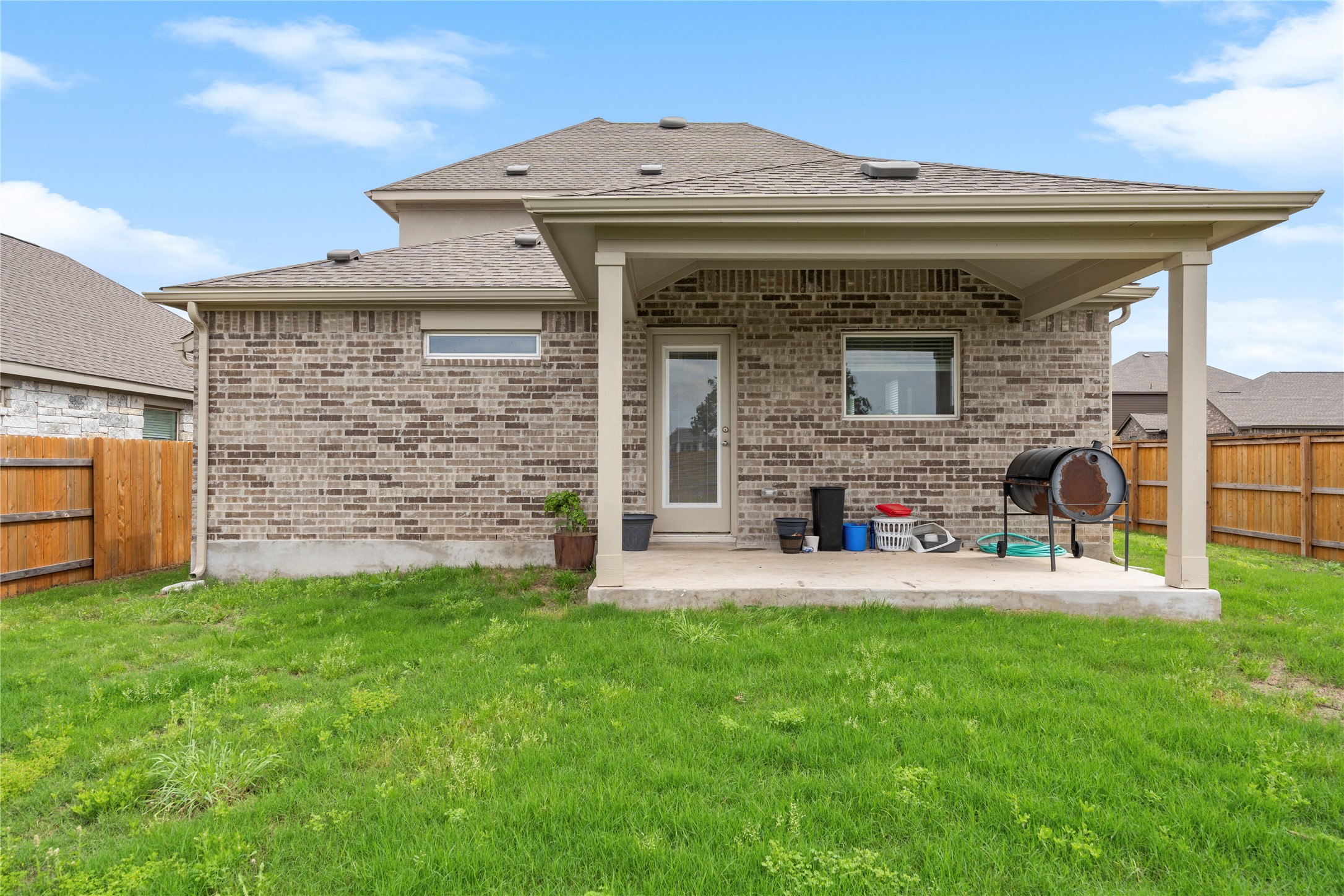 660 Pheasant Hill Lane Georgetown, TX 78628 - Photo 32 of 38 a view of a house with a yard and sitting area